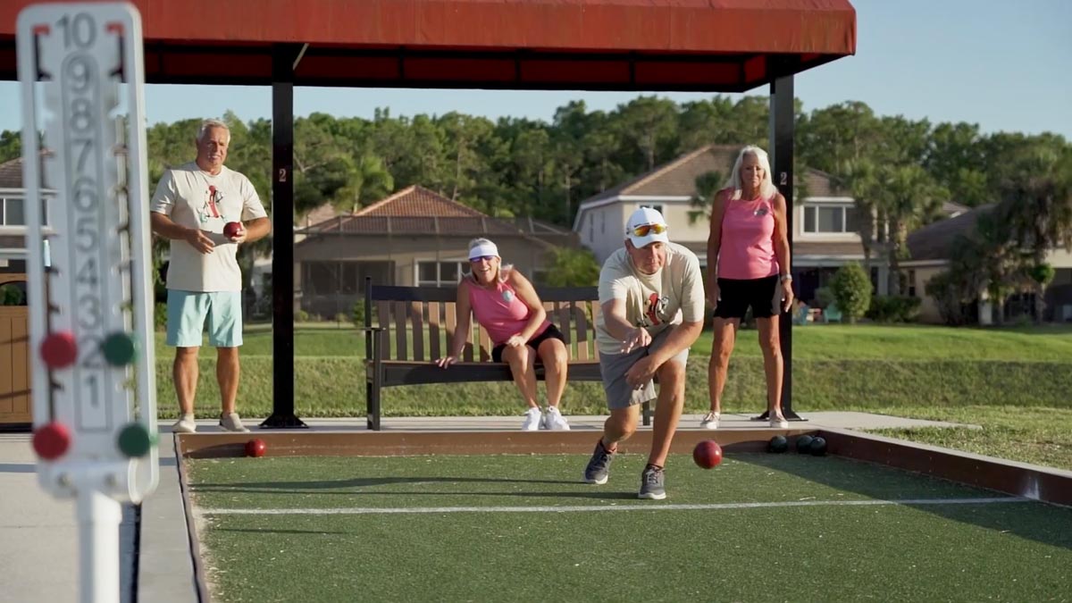 Two couples playing Bocce
