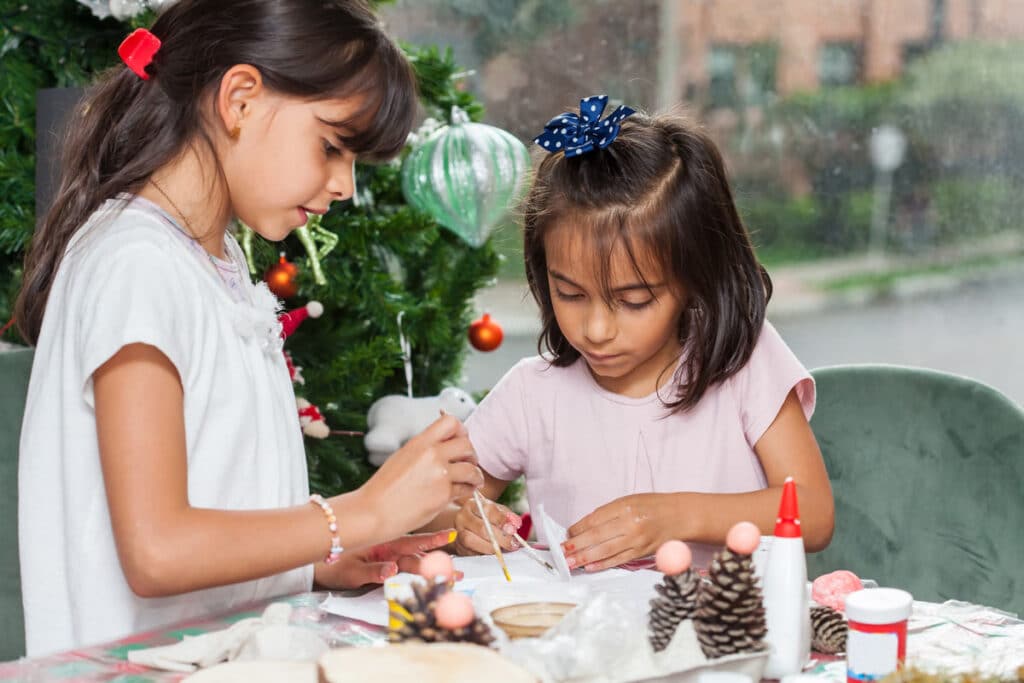 Sisters making holiday crafts